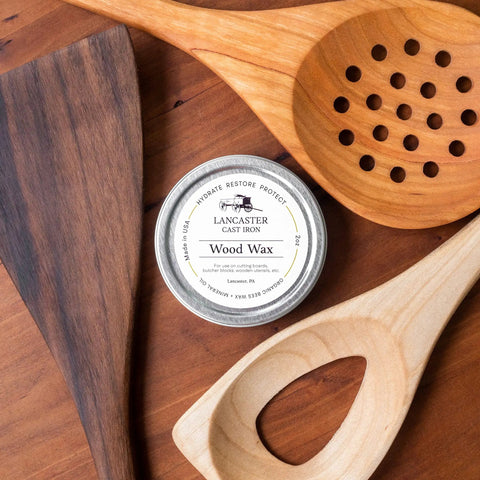 Must Have Everyday Wood Care Wax For Spoons Cutting Boards And Butcher Blocks With Beeswax And Mineral Oil Conditioner Two Oz Wood Butter To Hydrate Restore And Protect Woodenware Made In USA tin next to wooden utensils