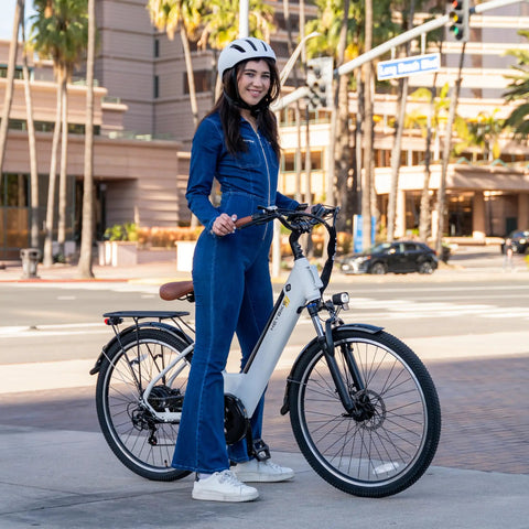 Woman on Cityscape 2.0 Electric Commuter Bike For Adults With 468Wh Removable Battery 26 Inch Wheels Up To 50 Miles in city
