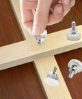 Hand inserting Heavy Duty M3 X 6mm Knurlled Thumb Screws Set Of Ten Slick Flat Heads into wooden surface for assembly.