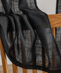 Cozy Tassel Linen Textured Swag Curtain Valance With Light Filtering Privacy For Farmhouse Kitchen Vibe And Small Windows 36x36 Two Pack In Black Durable Linen Blend For A Draped Look With Rod Pocket Top on chair