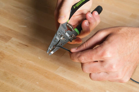 Hand using Stainless Steel Wire Stripper For 10-18 AWG Solid And 12-20 AWG Stranded, Heavy Duty Stripper Cutter And Crimper Tool