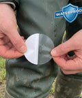 Close-up of hands holding adhesive patch from Boot And Shoe Repair Kit With Flexible Waterproof Adhesive For Soles And Uppers Easy Long Lasting Fix That Moves With Your Feet And Keeps Shoes Dry Like A True Workhorse.