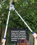 Person using Razorsharp Beefy Heavy Duty Telescopic Ratchet Loppers With Extendable 40.5 Inch Aluminum Handles on tree branch