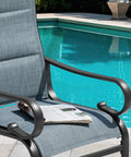 Set Of Two Padded Textilene Patio Dining Chairs With C Spring Rocker Action And Curved Armrests Rock Solid Powder Coated Metal Frame near pool.