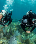 Two divers use Air Balanced Flow-Through Piston Regulator With Chrome Brass Body DIN Connection for cold water diving.