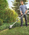 Man using Two Pack Ergonomic Trimmer Handle Set With Bracket Clamp For Aluminum Lawn Trimmers to trim grass in garden