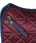 Close-up of Premium Satin Luxe Air Tec Quilted Dressage Saddle Pad with Breathable Mesh Spine in burgundy, dressage-ready.