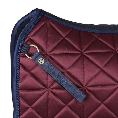 Close-up of Premium Satin Luxe Air Tec Quilted Dressage Saddle Pad with Breathable Mesh Spine in burgundy, dressage-ready.
