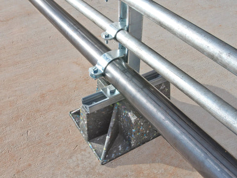 Saddle Support Rooftop Pipe Stand side view with silver pipes and U-clamp fasteners