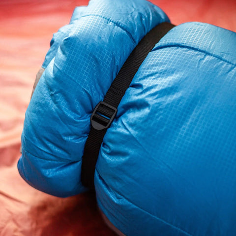 Rolled sleeping bag with black strap showing Two Pack 48 Inch Sleeping Bag Straps With Quick Release Buckles For Universal Fit