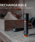 Torchy 2K Rechargeable Pocket Flashlight With 2000 Lumens in a workshop, showing magnetic base and USB recharging setup.