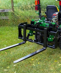 Dual Mount Tractor Pallet Forks For Front End Loader And 3 Point Hitch With 2 Inch Receiver Chain Hooks Weight Rack Gooseneck Mount Built Tough Black 36 Inch JDQA attached to a green tractor in a field.