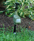 Motion Activated Animal Repellent Sprinkler For Yard Pest Control That Keeps Critters Away Including Cats Dogs Squirrels Deer Raccoons And Rodents With A Quick Water Burst Outdoor Lawn Protector Batteries Not Included Model 5277 in garden setting.
