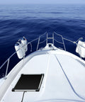 Heavy Duty Five Watt Solar Battery Trickle Charger With Overcharge Guard mounted on a boat deck overlooking the ocean.