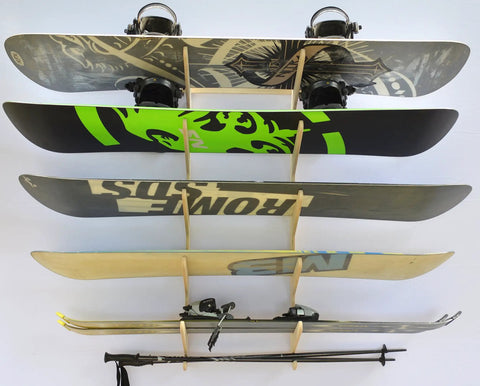 Premium Wall Rack Mount For Ski Snowboard And Longboard Storage Featuring Adjustable Baltic Birch Arms holding multiple snowboards and skis.