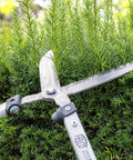 F25057 Swiss Made Hedge Shears For Gardening 22 Inch Lightweight Precision Clippers trimming green shrub
