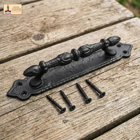 Heavy Duty Cast Iron Door Pull Handles Set Of 2 In Rustic Black With Colonial Victorian Style on wooden background