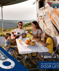 Family enjoying a picnic outside RV with Steel RV Water Heater Latch Twist Cam Lock Replacement Door Fastener visible in corner.