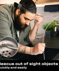 Man using Multipurpose Pickup Tool Set With 36 Inch Flexible Claw Grabber And Telescoping Magnetic Pickup Stick in kitchen sink