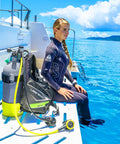 Diver with Liberator BCD With AWLS III And RiteTite Harness, medium size, preparing for a deep dive on boat deck.
