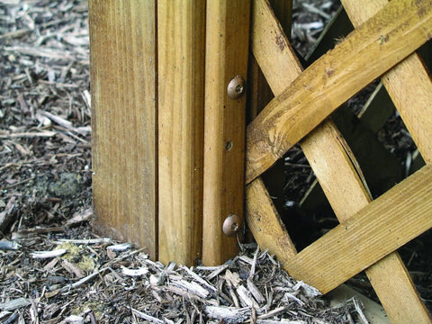 Top Shelf Construction Lag Screws 5 16 By 3 Inch Bronze Hex Fasteners 30 Pack securing wooden posts and lattice in garden project.