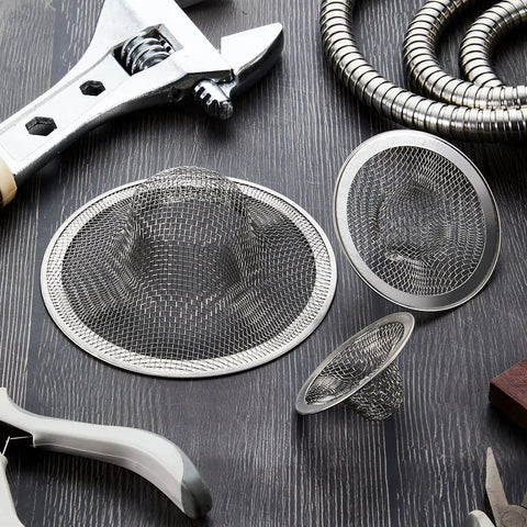 Stainless Steel Sink Strainer 12 Pack Heavy Duty Mesh Sieve Catches Food Gunk And Hair No Sweat Drain Catcher With Rust Proof Build That Nails Kitchen Cleanup For All Basins arranged with tools on a wooden surface.
