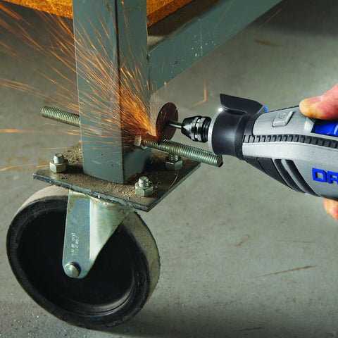 Using the Top Tier Variable Speed Rotary Tool Kit With Hella Steady Flex Shaft to cut metal, sparks flying from a bolt.