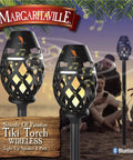 Waterproof Tiki Torch Bluetooth Speaker Two Pack Portable Party Speaker With Flickering LED Lights Perfect For Travel Backyard Parties Poolside And More, showing tiki torch design and LED flicker.