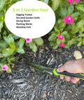 Hand Weeder Trowel With Ergonomic Handle And Rust Resistant Stainless Steel Your Go To 5 In 1 Garden Tool in use among flowers