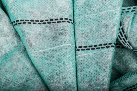 Close-up of folded green fabric of Activated Carbon Air Filter Set For 400 CFM Systems, 1 Micron Inner Filters, MERV 10, Two Pack.