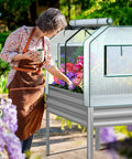 Self Watering Galvanized Raised Garden Bed With Legs And PE Cover For Vegetables And Flowers Outdoor Elevated Planter Box 48 By 24 By 56 Inches Easy Hands Free Watering For Backyard Patio Balcony with woman tending plants