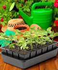 Seedling tray on wooden table with watering can and garden tools, featuring Eight Pack Replacement Capillary Mats For Seed Starting 13 By 8 Inches Self Watering Grow Mat Set For Indoor Gardens And Greenhouses No Hassle Seedling Hydration in use.