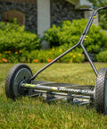 Side view of 16-Inch 7-Blade Push Reel Lawn Mower With Ball Bearing Reel And 10-Inch Composite Wheels on green lawn