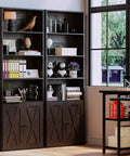 Industrial Bookshelf With Doors, 6 Tier Floor Standing Bookcase showcasing black wood frame filled with books and decor.