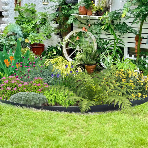 Garden with Easy Cut 1.5 Inch By 100 Ft Garden Edging Kit creating borders around flower beds with greenery and flowers.