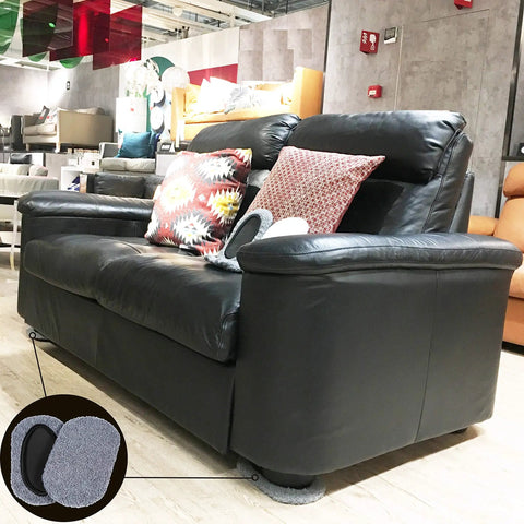 Black leather sofa on wooden floor with 8-Piece Furniture Moving Kit For All Floor Types 2-In-1 Reusable Sliders visible underneath