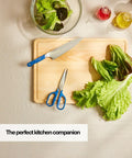 Heavy Duty Kitchen Shears For Everyday Chores, Pro Grade Stainless Steel Scissors For Meat, Herbs And Veggies, Ambidextrous Comfort Handle, Easy Clean Design, Durable Blue Kitchen Must Have on cutting board