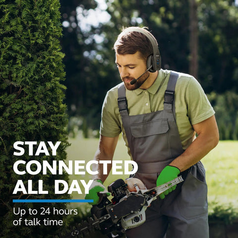 Man using Mono Bluetooth Trucker Headset With Mic 96 Percent Noise Canceling All Day Comfort Padded Headband Extended Wireless Range outdoors