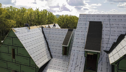 Top Shelf Synthetic Roof Underlayment Roll Covers 10 Squares installed on steep roof for durable waterproof barrier.