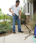 Man using Beast Mode Portable Pressure Washer 1900 PSI 1.51 GPM 14 Amp With Bayonet Attachments for cleaning driveway