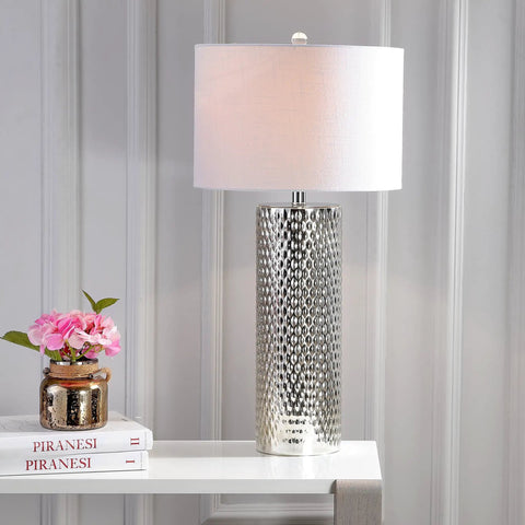Isabella Studded Glass Table Lamp, 30-Inch Contemporary Glam Silver Leaf Base With White Linen Drum Shade next to books on a white table