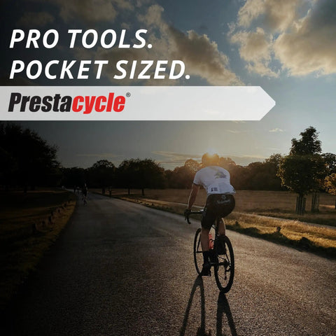 Cyclist riding on road at sunset with text overlay 'Pro Tools. Pocket Sized.' promoting T-Handle Ratchet Wallet Kit.