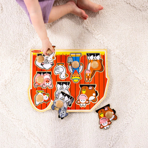 Child placing piece into Farm Animals Jumbo Knob Puzzle For Toddlers Wooden Peg Puzzle For Early Learning Shape Recognition