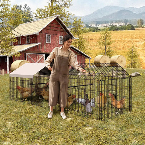 Woman tending poultry in heavy duty metal chicken run and coop system with 86 inch or 130 inch lengths portable outdoor cage, farm backdrop