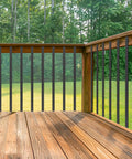 Built Tough Sixty One Pack Heavy Duty Black Metal Deck Balusters Plus Mounting Bolts 32 Inch installed on wooden deck.