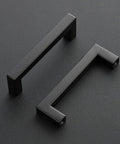 Two 25 Pack 4 Inch Square Cabinet Handles Matte Black Drawer Pulls For Cupboards And Kitchen Cabinets on black surface