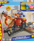 Hot Wheels Downtown Candy Shop Playset With 1:64 Scale Die-Cast Donut Shaped Car, Gumball Machine, Speed Snap Track, And City Racing Stories For Kids Of All Ages Poppin Fun packaging