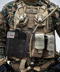 IFAK trauma kit in black MOLLE pouch with US flag patch on tactical vest
