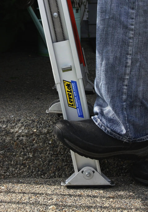 Complete Ladder Leveler Stabilizer Kit with Quick Connect extends 10 inches for safe use on uneven ground, mounted on a ladder.