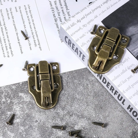 Two Pack Antique Bronze Duckbilled Hasp Clasp Latch Hardware Bronze Toggle Hasp Latches With Screws on a table
